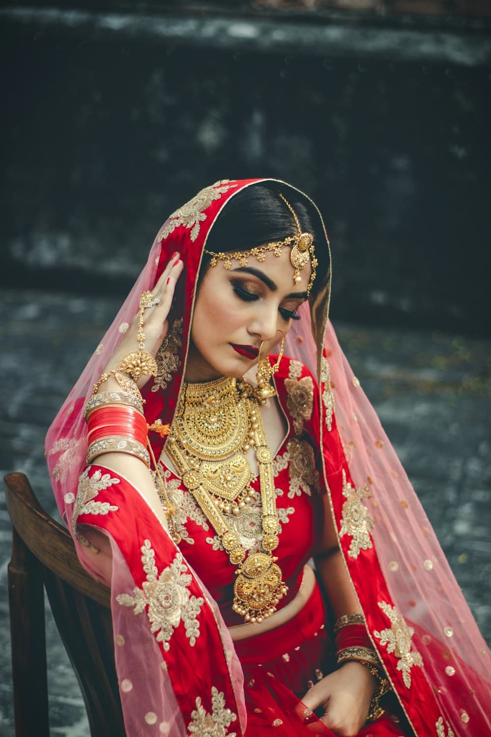 Bride in traditional red and gold attire